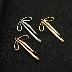 Polished bow charms in silver, gold, and rose gold finishes for DIY jewelry making