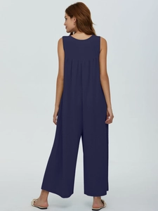 Macro view of the dark blue sleeveless jumpsuit showing vertical ribbed knit texture