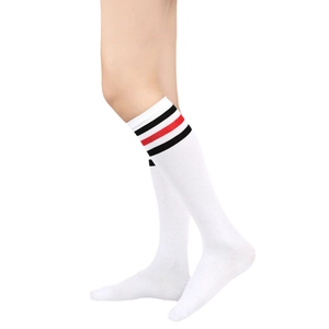 Close-up of white cotton knee-high socks with three black and red horizontal stripes