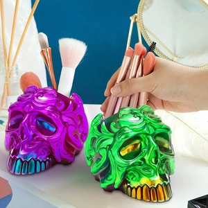 Detailed relief carving on iridescent skull makeup brush holder and storage container