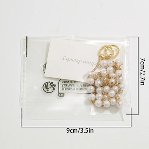 Detail view of pearl beaded necklace with gold rings and 7cm to 9cm size dimensions