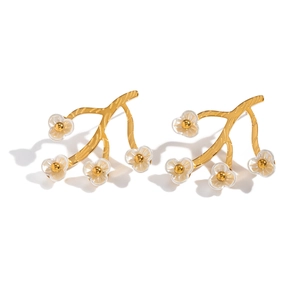 Detailed view of 18K gold stainless steel earrings featuring textured branch and floral design