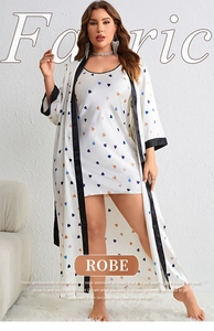 Detail showing plus size white satin robe set with colorful heart patterns and black trim