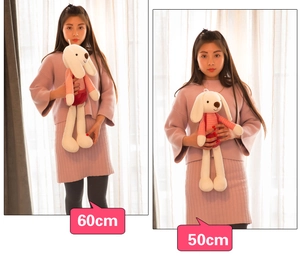 Size comparison showing 60cm and 50cm white plush bunny toys held by a model