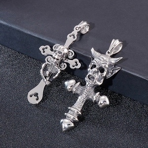 Detail shot of gothic stainless steel skeleton and devil face cross pendants for men
