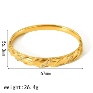 18k gold plated twisted titanium steel bangle with zircon inlay showing 67mm diameter