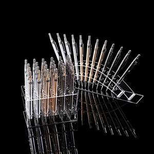 Clear acrylic pen display stands for eyebrow pencils and pens on reflective black background