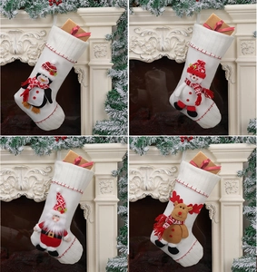 Detail view of four 3D Christmas stockings featuring Santa, Snowman, Penguin and Reindeer