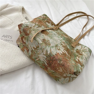 Vintage floral jacquard tote bag with sunflower pattern on white pleated fabric background