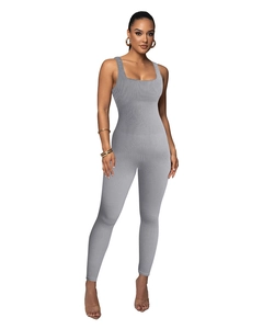Detail of ribbed gray yoga jumpsuit showing tight high-elasticity fabric and square neckline