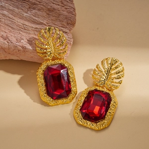 Vintage gold leaf drop earrings with large red geometric crystals in a luxury setting