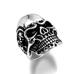 Macro shot of punk style stainless steel skull ring with vintage oxidized finish details