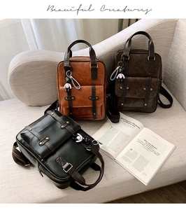 Close-up of three vintage PU leather backpacks in black, brown and coffee colors