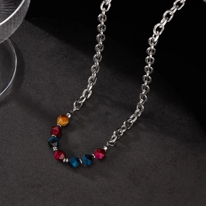 Stainless steel O-chain necklace featuring colorful natural stone beads on a black background