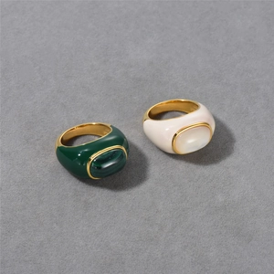 Detail of green and white enamel rings with malachite and mother of pearl in 18k gold