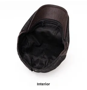 Macro view of men's beret featuring warm fleece lining and sturdy brown faux leather brim