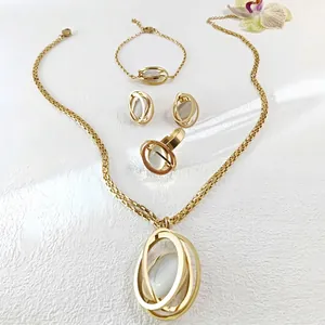 Elegant gold jewelry set with opal stones including necklace, bracelet, earrings and ring