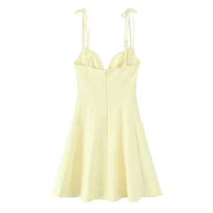 Detail of light yellow floral poplin dress fabric and high-quality stitching
