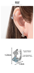 Detail view of cz clover hoop earrings showing dimensions 1.22cm by 1.4cm for women