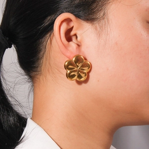 Polished 18K gold plated titanium steel hollow flower stud earrings for women