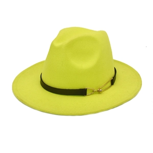 Detail of neon yellow fedora hat featuring a black leather band and gold metal buckle