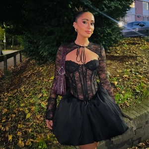 Elegant black lace long sleeve dress with corset style bodice and A-line mini skirt