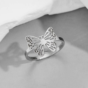Elegant silver butterfly hollow ring with adjustable band and minimalist steel design