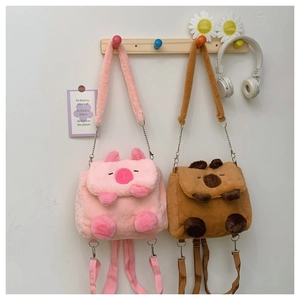 Pink and brown plush capybara backpacks with soft fur texture and metal chains
