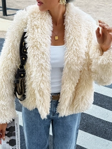 Close-up of the beige fuzzy jacket texture and stylish street style urban fashion view
