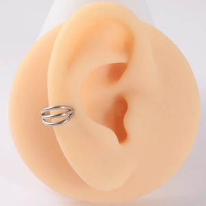 Close-up of silver layered titanium nose ring with zircon on a realistic ear model
