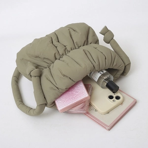 Quilted puffy hobo bag in khaki nylon showing spacious interior storage for essentials