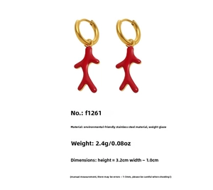 Detail view of gold earrings with red coral pendant showing dimensions and material specs
