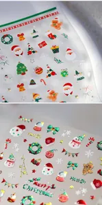 Macro detail of Christmas nail art stickers with embossed Santa and snowflake patterns