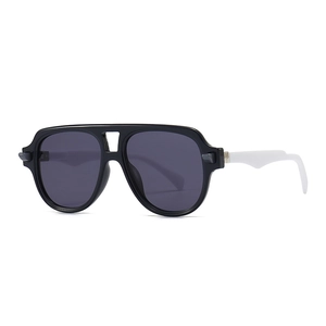 Retro pilot sunglasses with thick black frames and white temples for a modern trendy look
