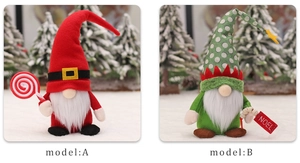 Detail view of red and green Christmas gnomes with lollipops and NOEL wooden signs
