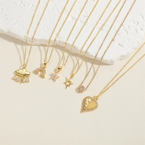Close-up of six gold-plated necklaces with rainbow, flower, and heart zircon pendants