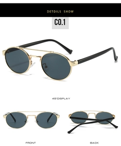 Macro view of retro double-bridge oval sunglasses with gold frame and dark lenses