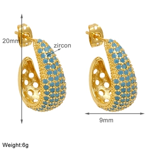 Detail view of 20mm gold-plated C-shaped hoop earrings featuring blue zircon pavé setting