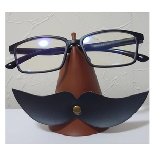 Detail of TR90 1.8X magnifying glasses on a creative leather cone-shaped storage holder