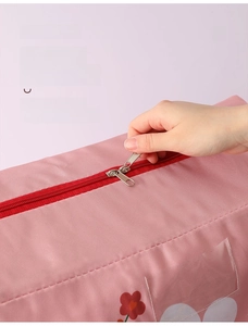 Detail of pink storage bag showing smooth two-way zipper and reinforced stitching