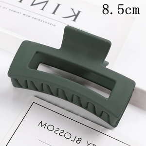 Detail view of large 8.5cm dark green matte rectangular hair claw clip for women