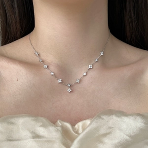 Elegant 925 sterling silver necklace with four-petal flowers and sparkling zircon stones