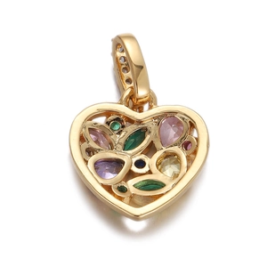Detailed close-up of golden heart pendant with colorful zircon stones and hollow design