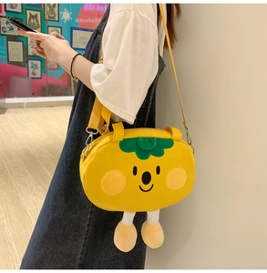 Cute yellow cartoon crossbody bag with embroidery smile and green leaf decoration detail
