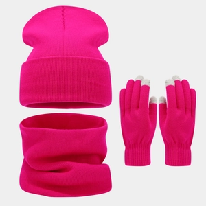 Detail of rose red winter knit set featuring touchscreen gloves, scarf, and warm beanie