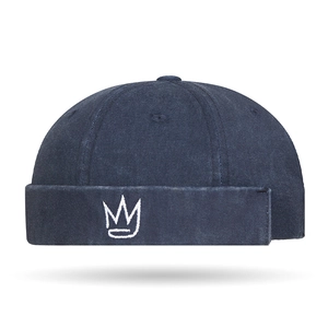 Navy blue docker hat with white crown embroidery made of washed cotton twill fabric