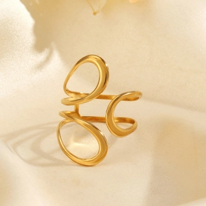 Minimalist gold hollow layered ring with abstract wire wrapped design on white satin cloth
