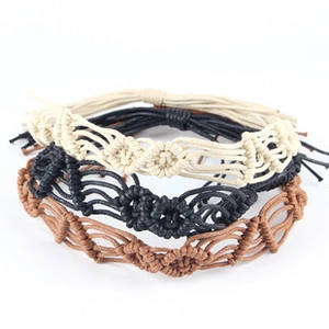 Close-up of woven hemp ropes in black, beige, and brown for DIY hat and jewelry decor