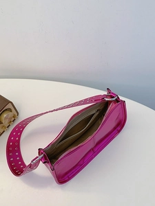 Metallic rose pink PU leather shoulder bag with punk studs and metal eyelet strap