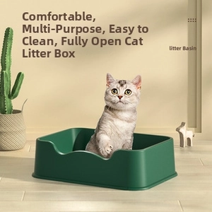Macro view of a dark green open-top cat litter box on wooden floor with a cat inside